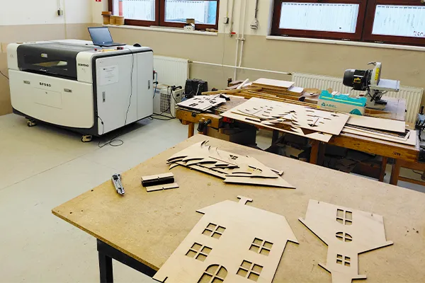 Making wooden decorations in the school workshop